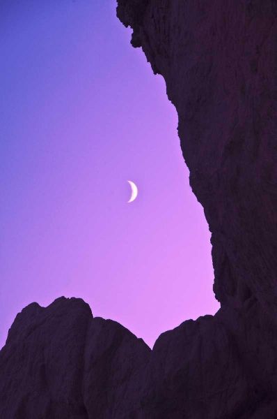 OR, Crescent moon framed by sea stacks